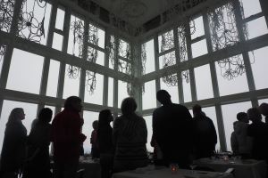 Silhouette of crowds in window frames